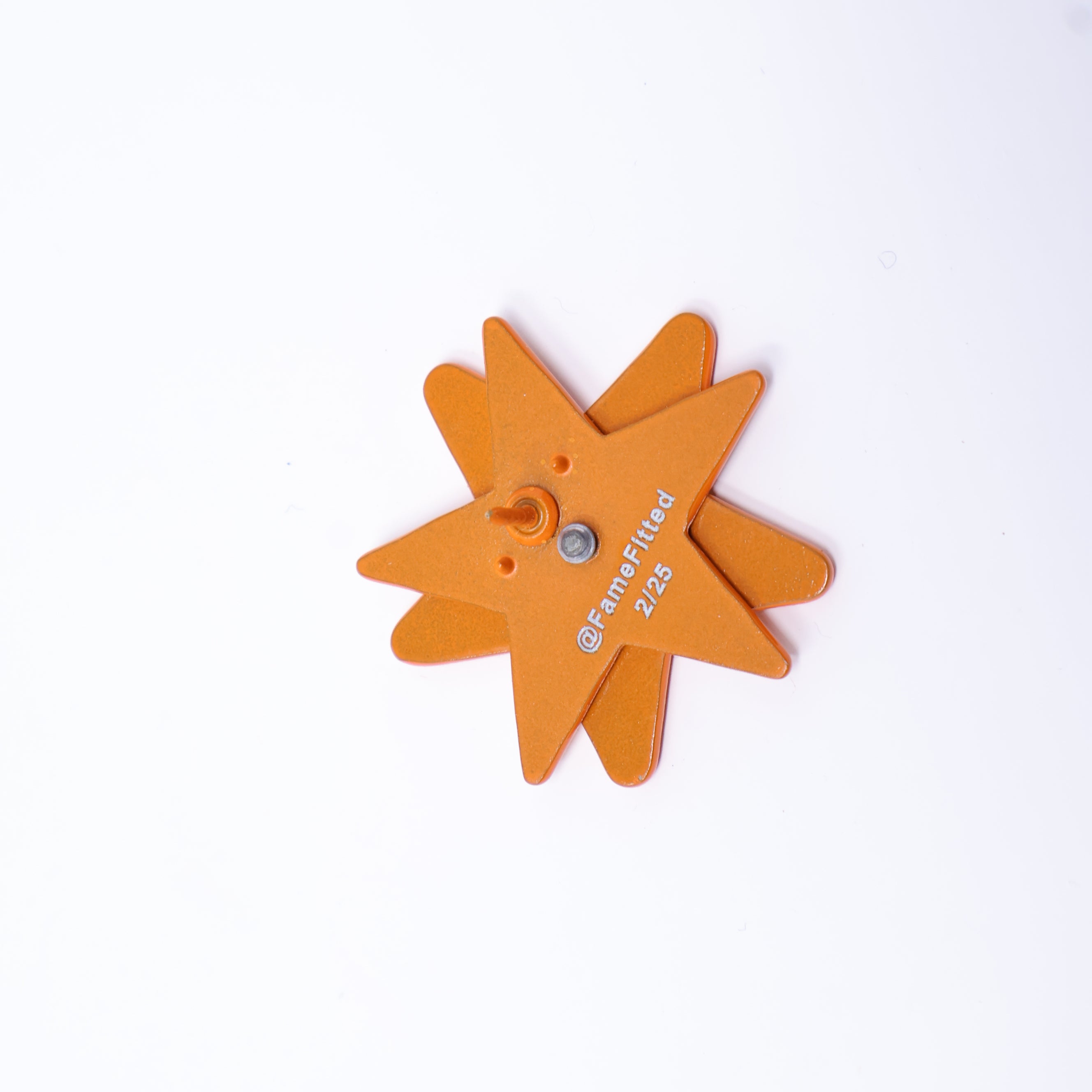 Orange White Star Spinner Graphic Pin