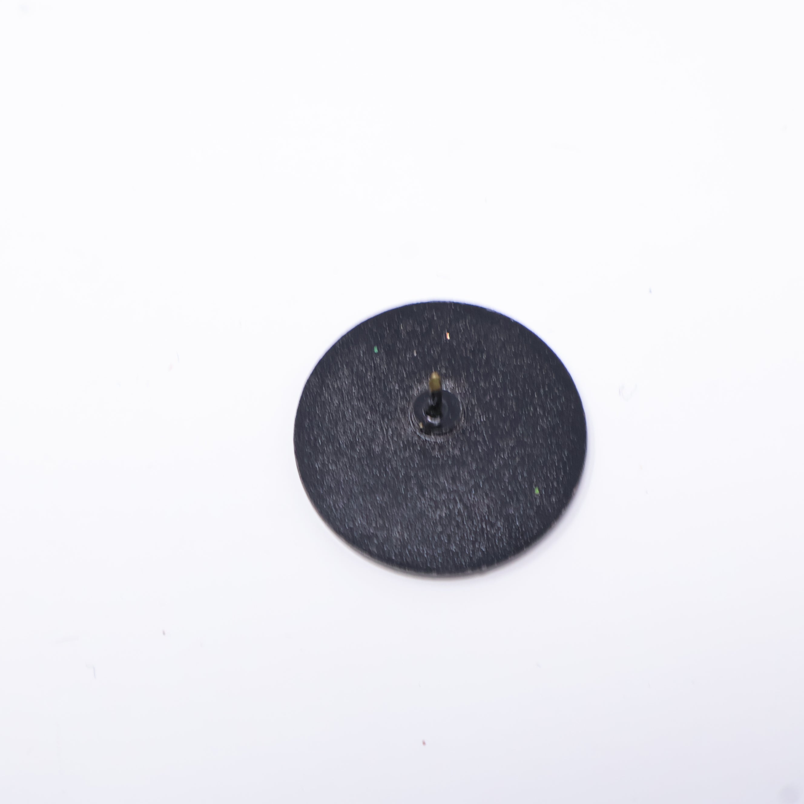 CozyBrimz Black Smiley Face Coin Pin