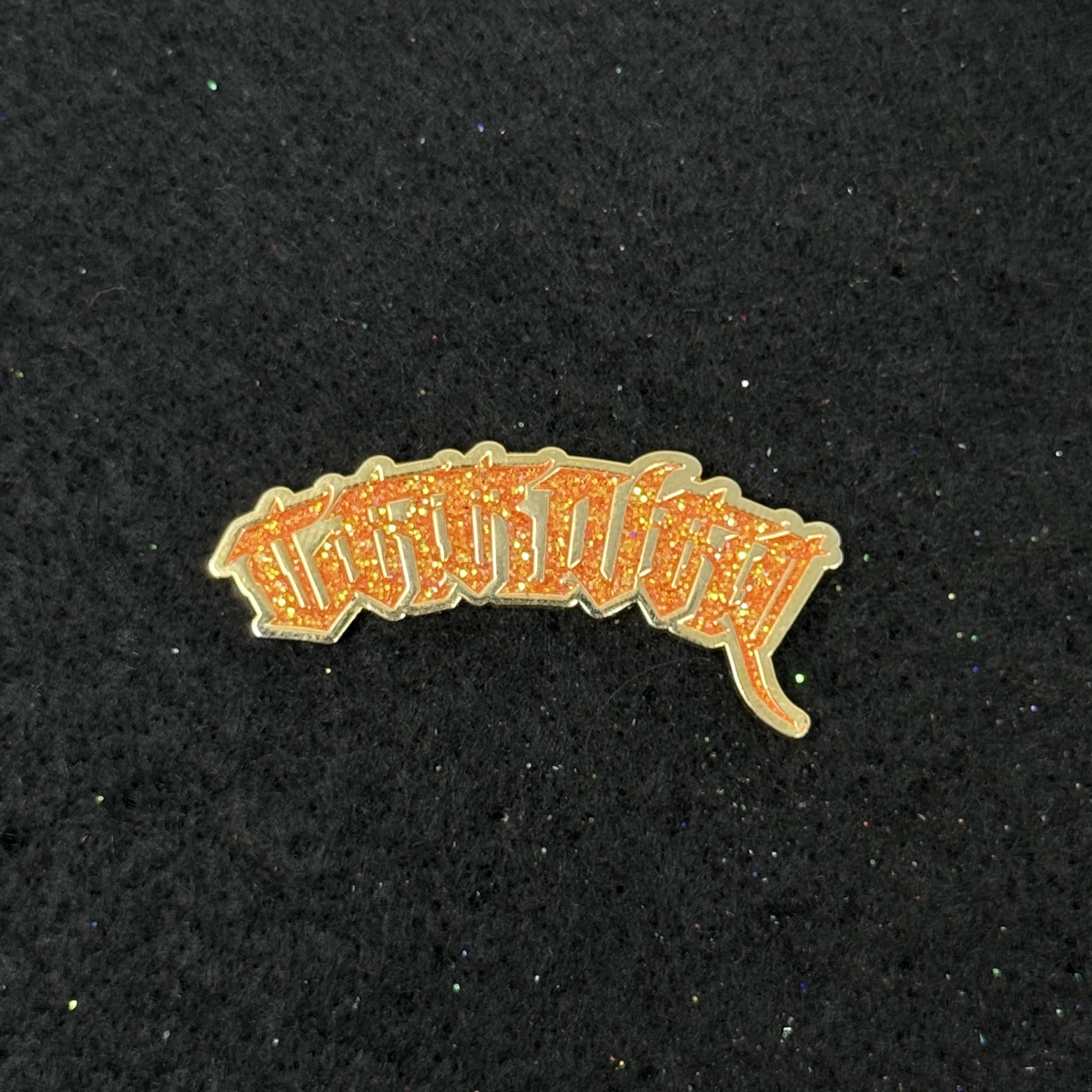 Orange "CARNAL" Script Pin