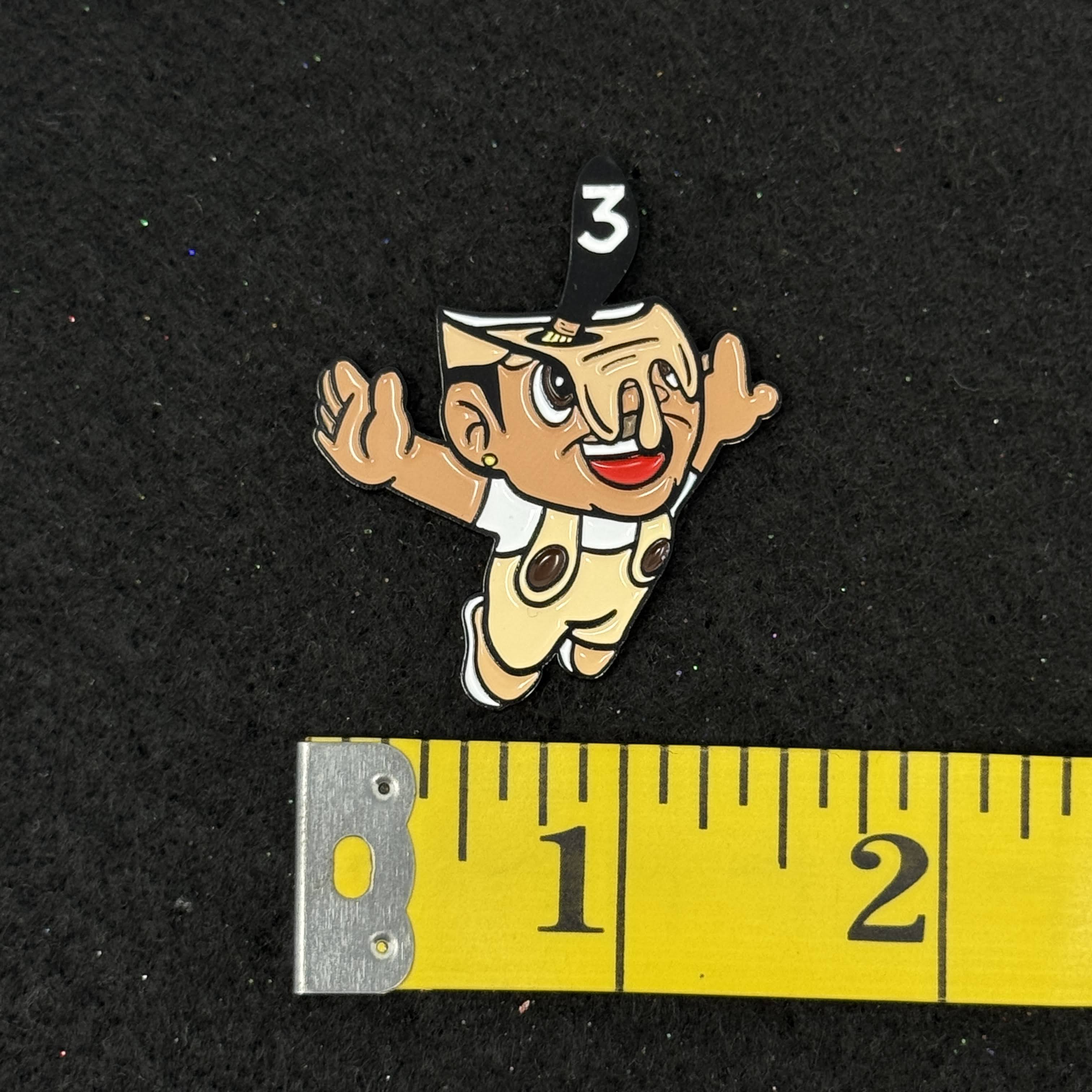 Flying Man Pain Bucket Black Plating Graphic Pin