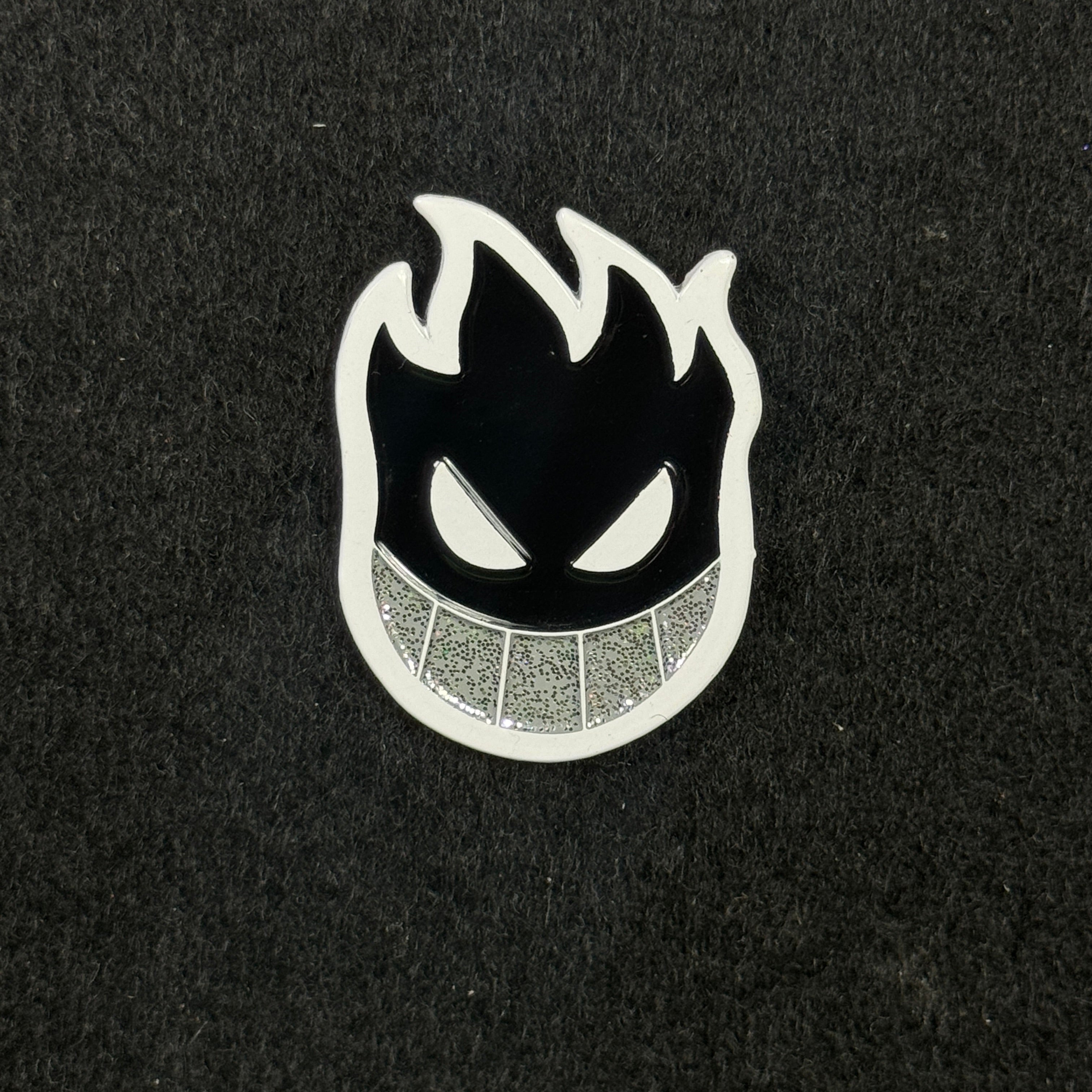 CozyBrimz Black/White Smiling Flame face Graphic Pin